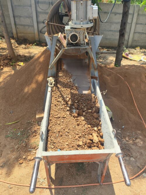 Soil excavated from the land being carefully filtered to remove stones and debris 