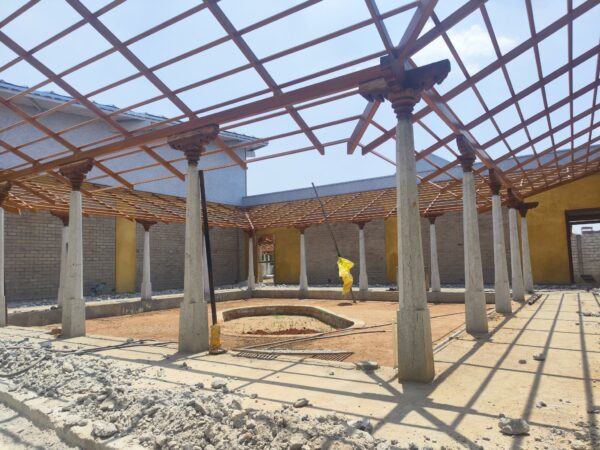 A sunlit space between the on-campus offices under construction