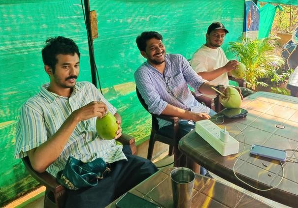The team enjoying fresh coconut water 
