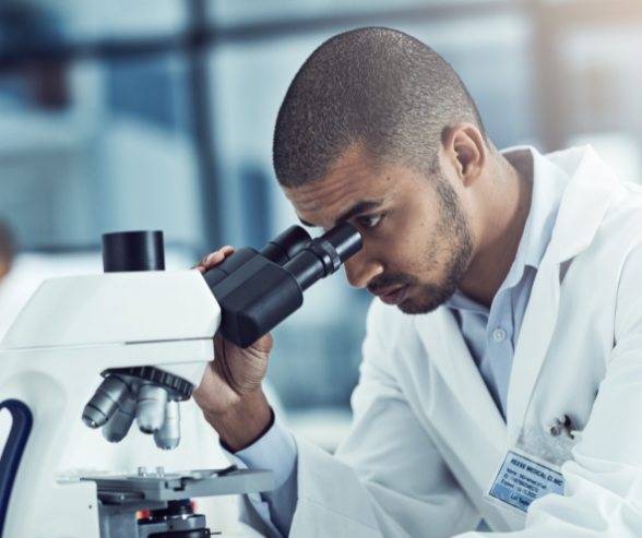 A man using the microscope